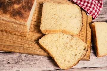 Slices of white bread on a cutting board. aereal view.