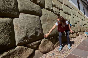 Admiring the perfection of the 12-Angle Stone in Cusco.A moment where beauty meets history, celebrating the genius of Inca engineering and the enduring spirit of this sacred land