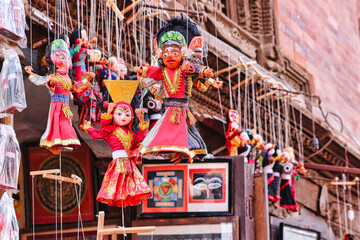 Traditional Nepali wooden puppets depicting gods and goddesses on display at a tourist shop near...