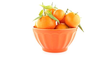 Tangerines on ceramic orange bowl