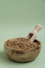 Raw buckwheat porridge Gluten free cereals. Health gut benefits. Concept of alternative whole spelt grain ingredient. Vegetarian diet recipes. Plant-based lifestyle. Copy space Protein rich eating 