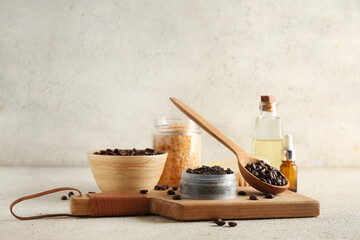 Composition with jar of coffee body scrub, cutting board and coffee beans on light grunge background