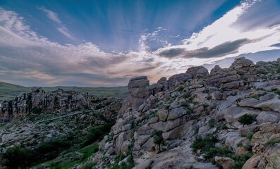 Exploring the unique rock formations in Jimustai, Inner Mongolia during sunset