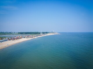 Bohai Bay Dongdaihe summer seaside scenery showcases tranquil shoreline and clear blue waters