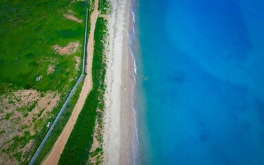 Vibrant summer vista of Pigeonhole Scenic Area in Beidaihe showcasing a beautiful shoreline and clear blue waters