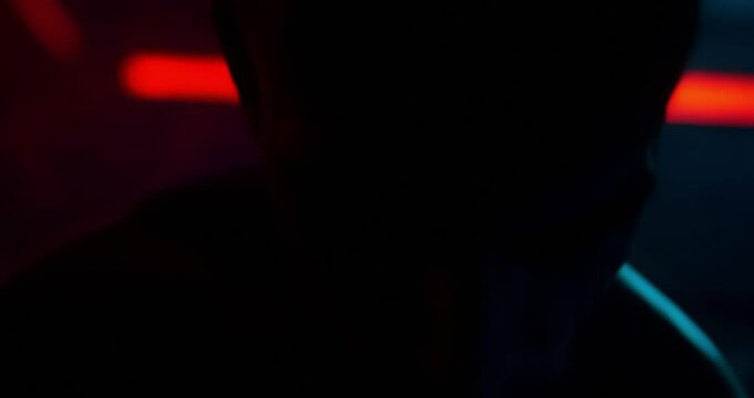 A male boxer in training depicted in an eerie, creepy atmosphere, using dark tones, unsettling details, and electric vivid colors.