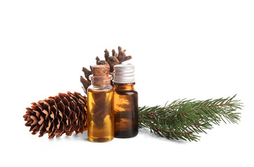 Bottles of essential oil with pine cones and fir branch on white background