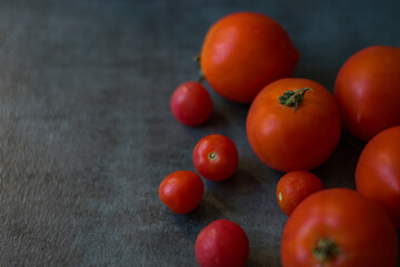 Close-Up of Ripe Red Tomatoes on Gray Background