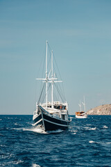 Fototapeta premium Pinisi boat behind our sail boat