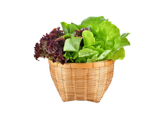 Various fresh salad vegetables in bamboo basket isolated on transparent or white background