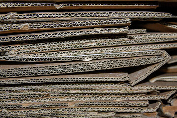 Stack of used folded cardboard boxes for recycling