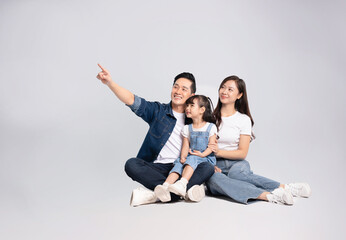 Generated Imagefull body  of a happy asian  family posing on a white background