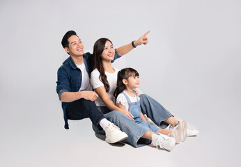 full body  of a happy asian  family posing on a white background