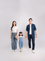 full body  of a happy asian  family posing on a white background