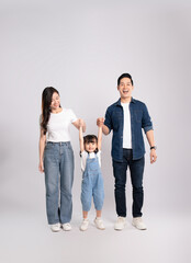 full body  of a happy asian  family posing on a white background