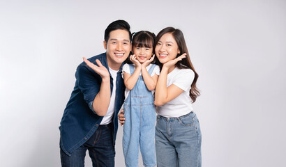Fototapeta premium portrait of a happy asian family posing on a white background