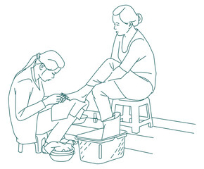 Woman doing Pedicure in the Streets of Vietnam