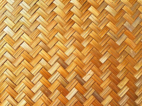 A neat and symmetrical traditional bamboo weaving pattern. The natural color of bamboo. This weaving is commonly used as a material for traditional house walls and crafts.