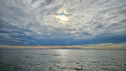 Sunrise with cloudy sliver sky at the sea landscape after rain season.