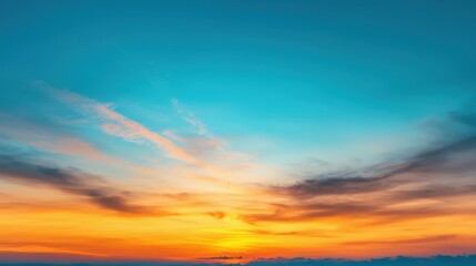 Fototapeta premium Vibrant Sunset Over Cloudy Horizon with Blue and Orange Sky