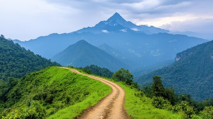 Obraz premium Scenic Mountain Trail Overlooking Lush Green Valley in Nature