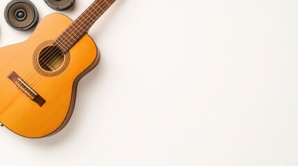 A wooden acoustic guitar with vintage speakers on a plain background, evoking a sense of music and nostalgia.
