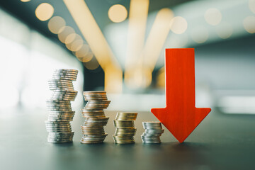 Down arrow with coin stack. concepts for success, methods, systems of raising or lowering Fed...