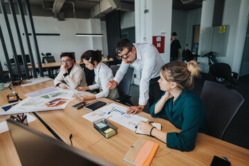 A group of business professionals engaged in a collaborative meeting, discussing projects and analyzing strategies. The modern office setting emphasizes teamwork and innovation.