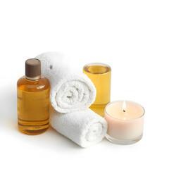 A rolled white towel, massage oil, and a burning candle arranged neatly, isolated on white