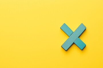 Obraz premium X symbol made of wood on yellow background