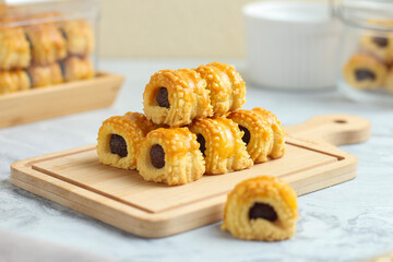 Nastar gulung or pineapple tart roll. Islamic holiday traditional snack or cookies. perfect for recipe, article, catalogue, or any commercial purposes.