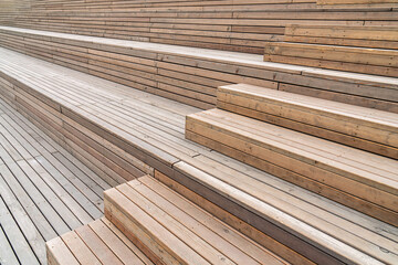 Wooden steps and seating area with smooth finish, clean lines, and a modern outdoor design concept. Natural aesthetic