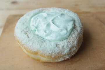 close up of a bun with icing sugar