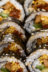 Gimbap or kimbap, Korean food made from cooked rice with vegetables, meat, egg and wrapped with dried seaweed
