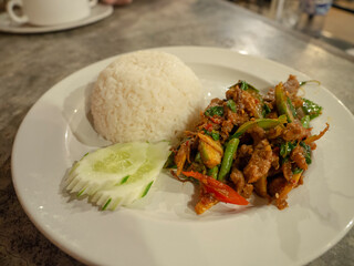 Rice with stir-fried pork and basil in thai style