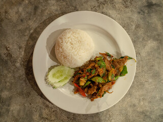 Rice with stir-fried pork and basil in thai style