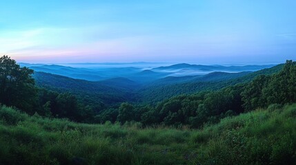 Naklejka premium Panoramic mountain landscape layers of blue tinted ridges
