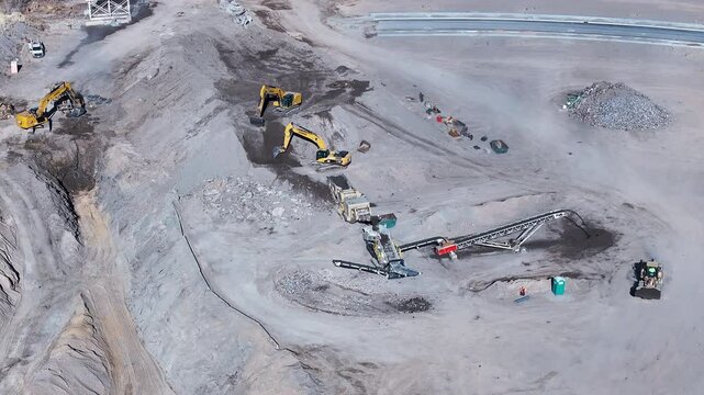 Aerial heavy equipment operation Payson Utah circle. Central Utah city. New home construction, heavy industrial earth moving equipment. Urban and rural landscape in mountain valley. 