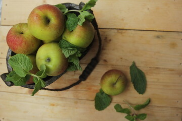 apples and pears on wooden table
