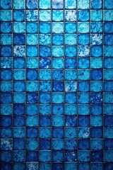 A large mosaic tile with a blend of blues used as a wall backing, blue mosaic abstract tile background, artistic wallpaper, decorative backings