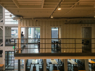 Buildings constructed by combining modular shipping containers, repurposed into cultural spaces,...