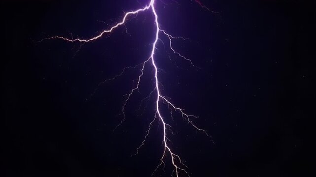 Powerful lightning bolt streaks across dark sky, illuminating night with glowing trails that fade into natures storm, creating mesmerizing display of electricity.