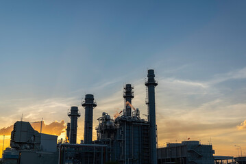Oil refinery industry at sunset - factory - petrochemical plant