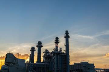 Oil refinery industry at sunset - factory - petrochemical plant