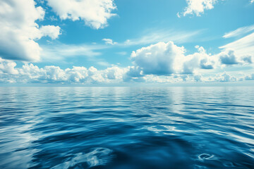 Obraz premium Large water body with blue sky and clouds in the background