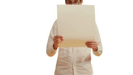 Person holding a blank sheet of paper in a bright room