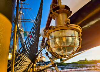 Old lantern and ropes stretched across the masts of an old ship