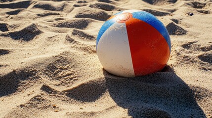 Obraz premium Beach ball on sandy shore fun summer activity coastal environment close-up perspective