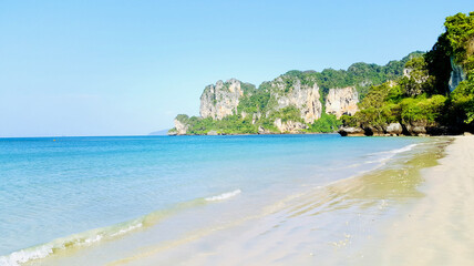 beautiful beach, white sand and clear sea with Limestone Mountain and cliff at Railay beach, Krabi, Thailand