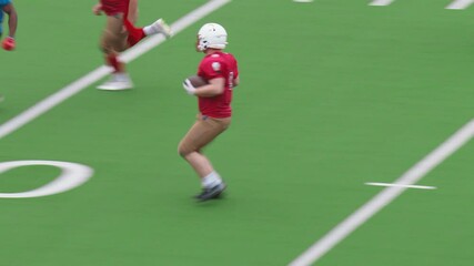 American Football Game with Athletes in Red Gear Sprinting Across the Turf with the Ball, Coordinating Offensive and Defensive Strategies with Speed and Power. Team is Ready to Make a Touchdown - Powered by Adobe